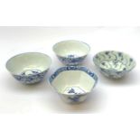Four blue and white Chinese tea bowls, comprising an 18th century example,