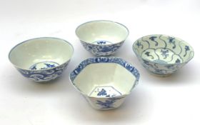 Four blue and white Chinese tea bowls, comprising an 18th century example,