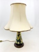 A large Moorcroft table lamp, decorated in the Lamia pattern, with bulrushes and water lilies,