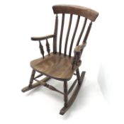 20th century farmhouse style beech rocking chair, turned supports joined by stretchers,