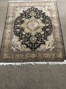 Fine Tabriz beige ground rug, repeating border, central medallion, 350 kpsi,