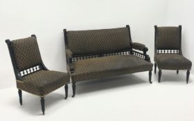 Victorian ebonised two seat sofa, upholstered back seat and arms, gallery backs,