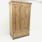 Early 20th century French pitch pine double wardrobe, projecting cornice,