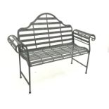 Distressed metal bench, shaped back and scrolled arms, W135cm,