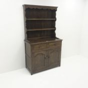 Victorian style oak dresser, raised two tier plate rack above two drawers and two cupboards,