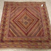 Gazak maroon ground rug, four central diamonds,