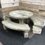 Composite stone garden table and bench suite - comprising circular table on quadruple S-scroll