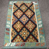 Choli Kilim cyan ground rug, geometric patterned field,