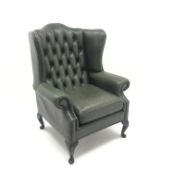 Queen Anne style wingback armchair upholstered in deep buttoned green leather, cabriole legs,