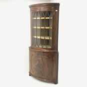 20th century figured mahogany bow front corner cabinet, projecting cornice, dentil frieze,