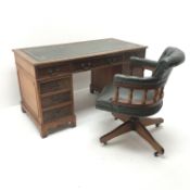 20th century mahogany twin pedestal desk fitted with nine drawers and matching swivel desk chair,