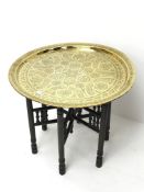 20th century Benares type table, circular brass top with engraved decoration,