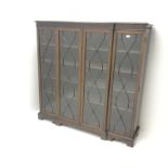 Georgeian style mahogany breakfront bookcase, moulded top above fretwork frieze,