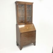 Edwardian inlaid mahogany bureau with later bookcase, projecting cornice,