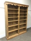 Large pine bookcase, projecting cornice, twelve shelves, plinth base, W185cm, H229cm,