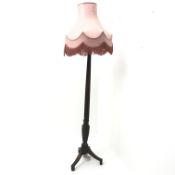 Early 20th century turned and fluted mahogany standard lamp with shade,