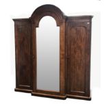 Victorian mahogany triple breakfront wardrobe with arched top, projecting cornice,