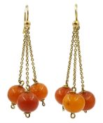 Pair of gold Early 20th century amber bead pendant earrings