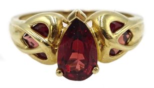 9ct gold pear shaped garnet ring, with garnet shoulders, hallmarked