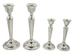 Pair of silver candlesticks by A T Cannon Ltd, Birmingham 1972 and similar pair of dwarf candlestick