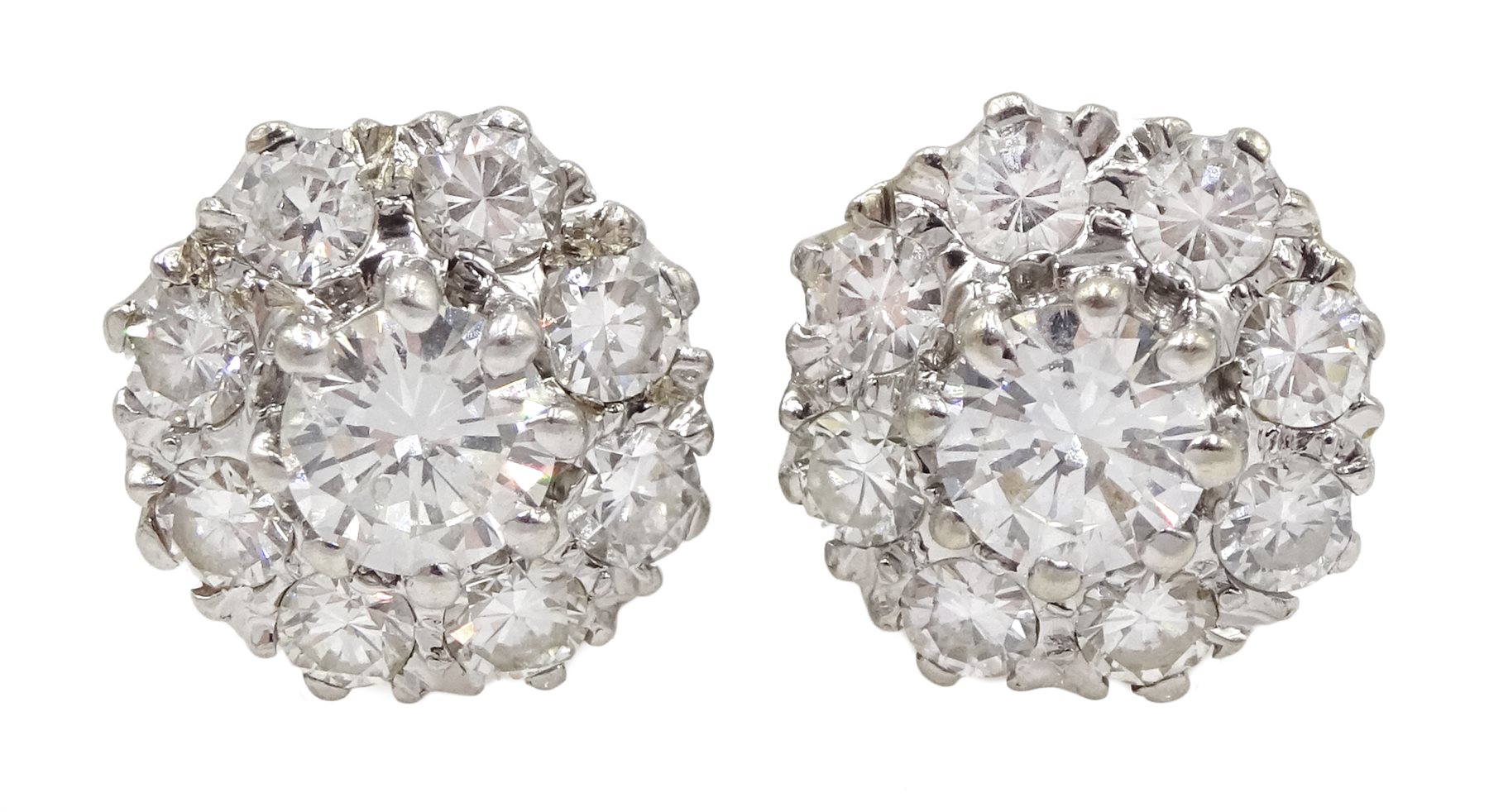 Pair of gold diamond cluster stud earrings, each central diamond approx 0.25 carat