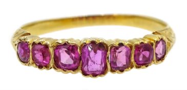 Early 20th century 18ct gold graduating seven stone, cushion cut ruby ring