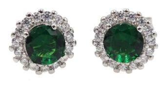 Pair of silver green stone and cubic zirconia halo stud earrings, stamped 925