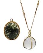 Gold mounted moss agate pendant and gold mounted crystal ball pendant on gold chain stamped 9ct