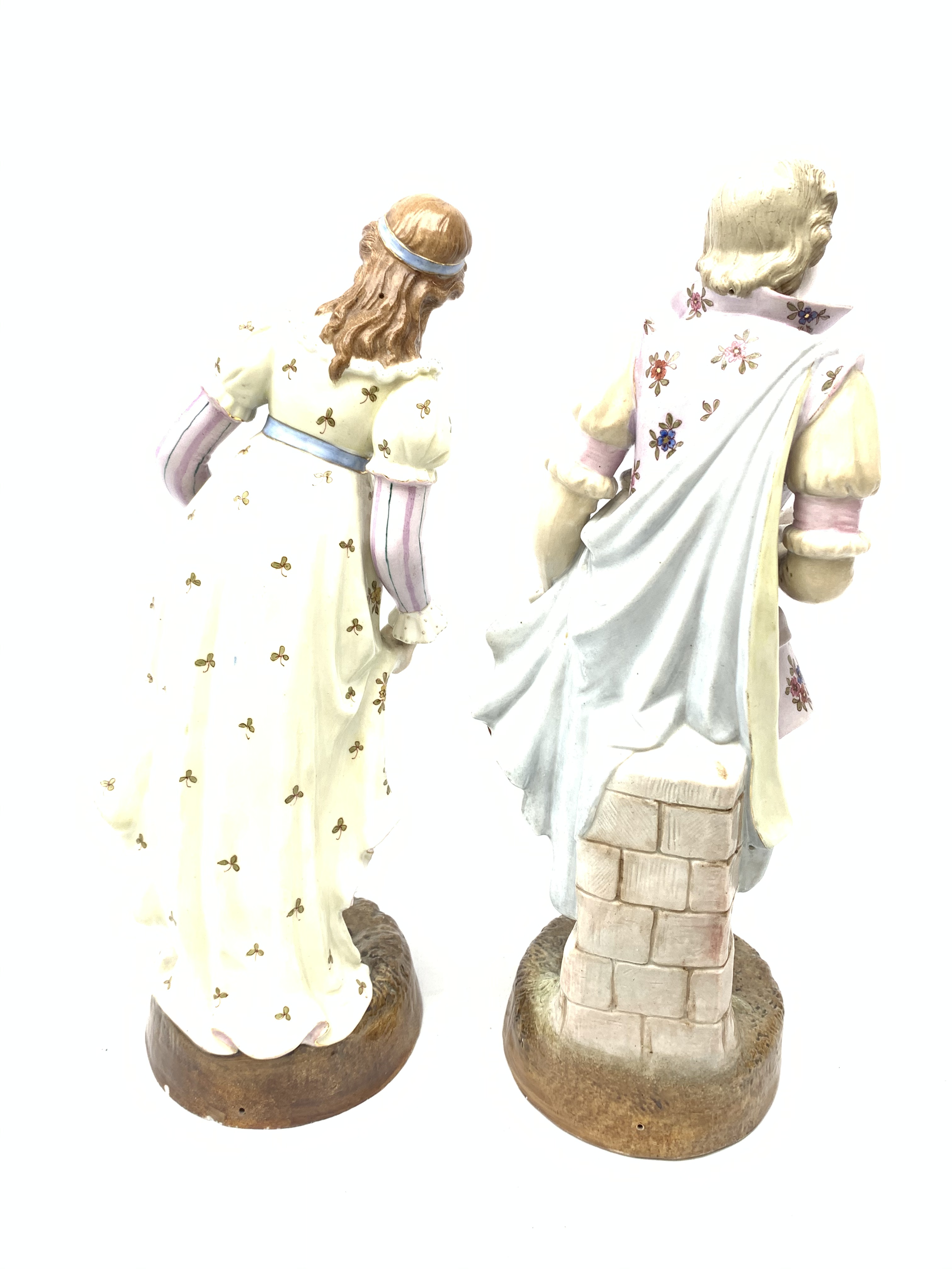 A pair of Continental porcelain figurines, the first modelled as a female figurine in floral dress, - Image 2 of 6