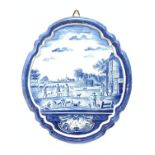 A late 19th century/early 20th century Dutch Deltware blue and white wall plaque, of oval form decor