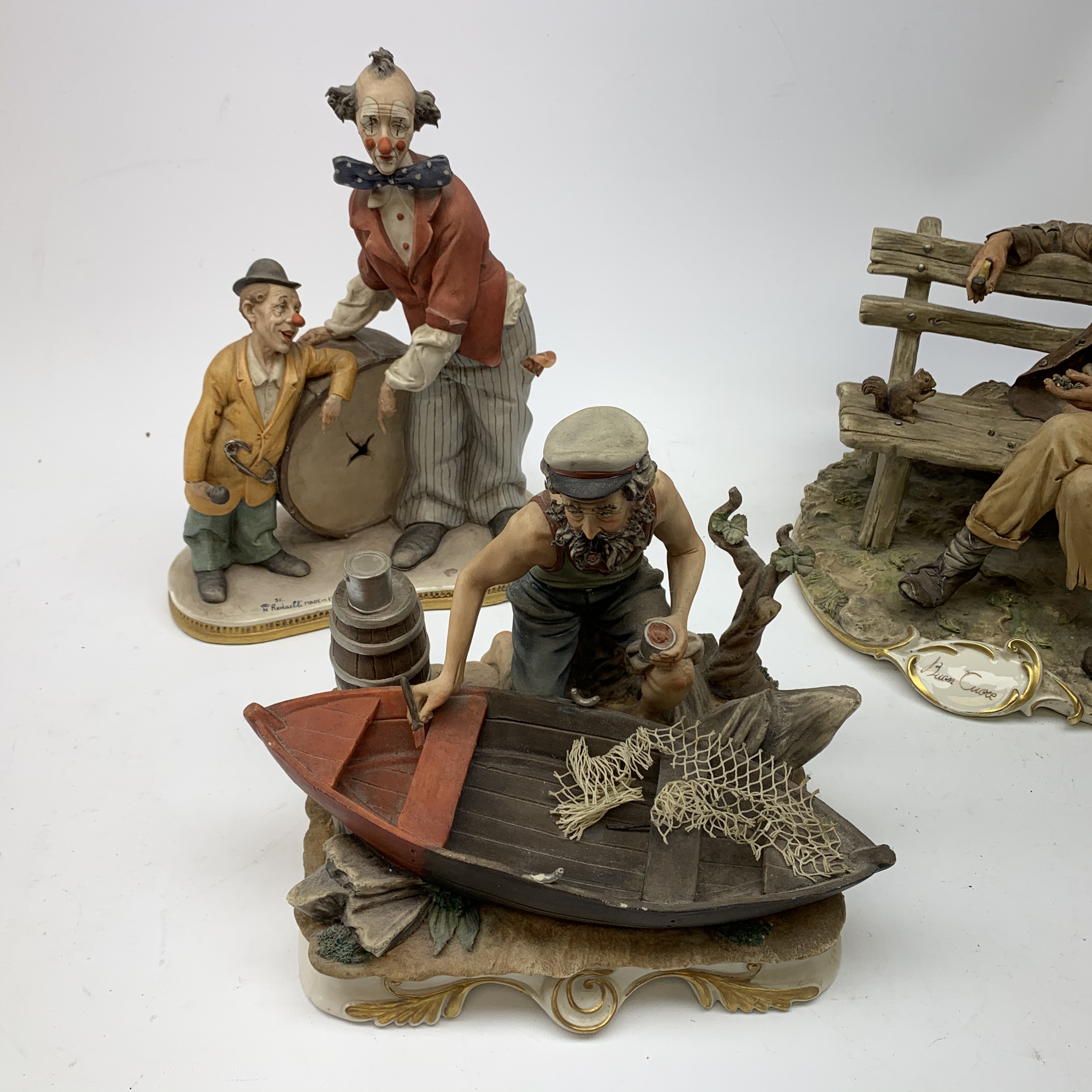 A group of four Capodimonte figurines, comprising The Fisherman, Tramp on Bench, each with accompany - Image 2 of 3