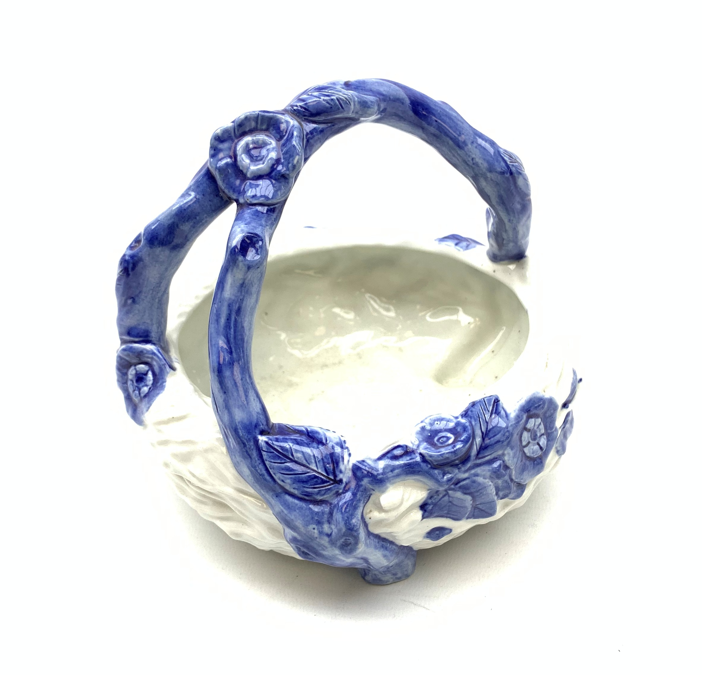 A late Victorian Royal Worcester blue and white basket, modelled as a birds nest with naturalistical