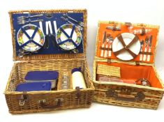 Two wicker picnic baskets, the largest by Optima and fitted for four people, the smaller unmarked a