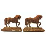 A pair of cast iron door stops, each modelled as a horse, H24cm L30cm.