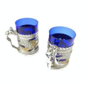 A pair of chromium plated mugs, the bodies detailed with pierced Chinoiserie bands, leading to figu