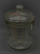 An early 20th century Vintage Smith�s Crisps glass counter top jar, of cylindrical form, the removab