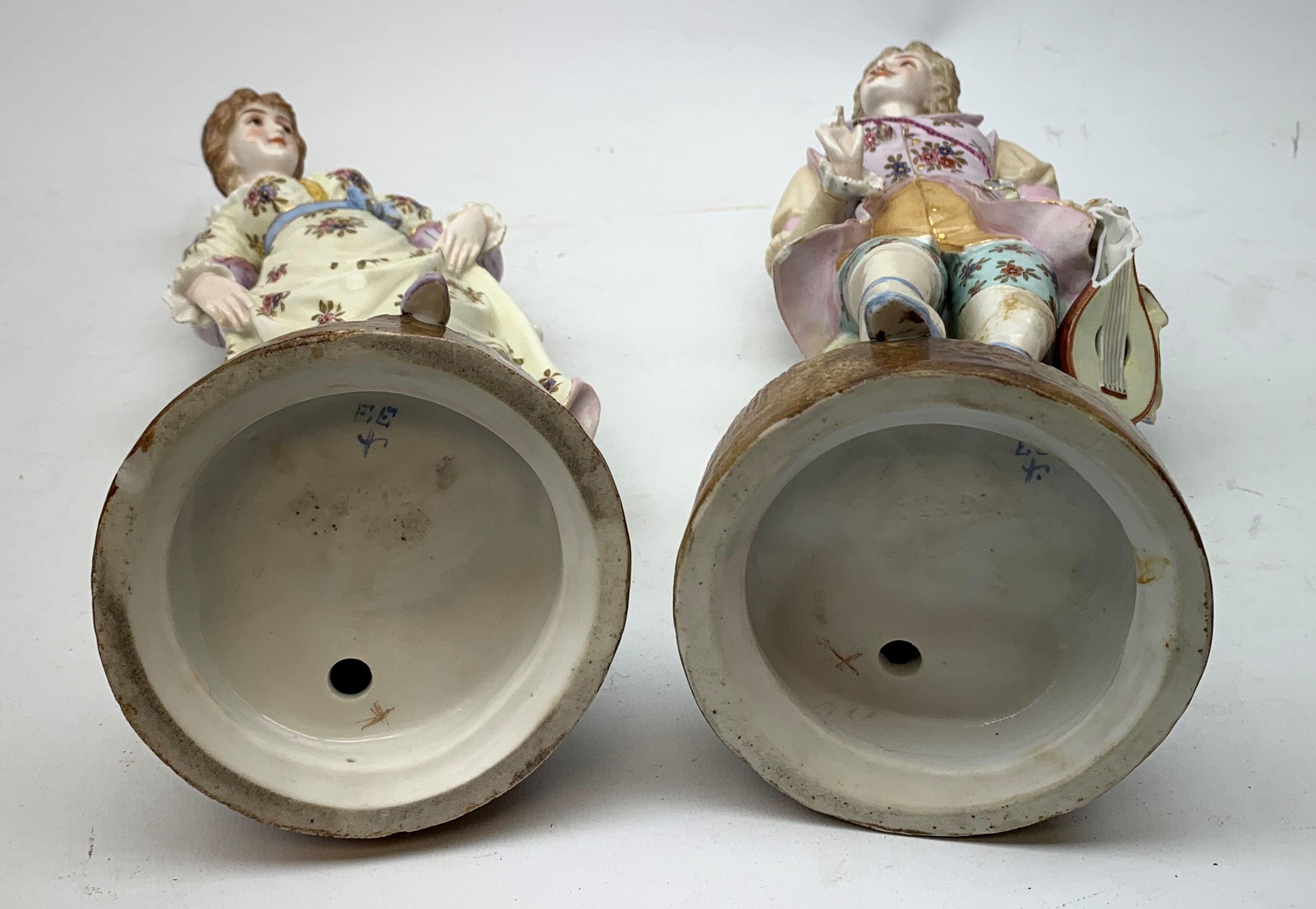 A pair of Continental porcelain figurines, the first modelled as a female figurine in floral dress, - Image 5 of 6