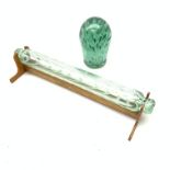 A 19th century Nailsea style glass rolling pin, with wooden display stand, L40cm, together with a Vi