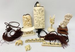 A small group of early 20th century ivory and bone, to include two carved inros, two small carvings,