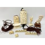 A small group of early 20th century ivory and bone, to include two carved inros, two small carvings,