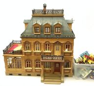 A child's Playmobil Victorian mansion dolls house, together with a good selection of accompanying p