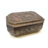 A 19th century black lacquer Chinese box, of rectangular form with canted corners, decorated in red