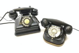 A Vintage black Bakelite telephone, together with another vintage metal bodied example with Bakelit
