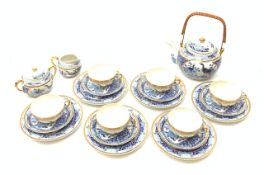 A Japanese eggshell porcelain teaset, comprising six teacups each with Geisha lithophane panel, six