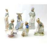 A group of Spanish figurines, to include examples bv Lladro and Nao.