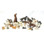 A group of fourteen Beswick dogs, to include Corgi, Pug, Yorkshire Terrirer, three Spaniels, three
