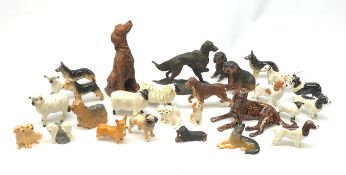 A group of fourteen Beswick dogs, to include Corgi, Pug, Yorkshire Terrirer, three Spaniels, three