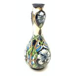 A Moorcroft vase of bulbous form with tall waisted neck, decorated in the Centaurea pattern, designe