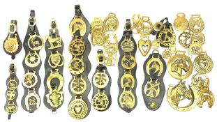 A collection of assorted horse brasses.