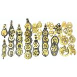 A collection of assorted horse brasses.